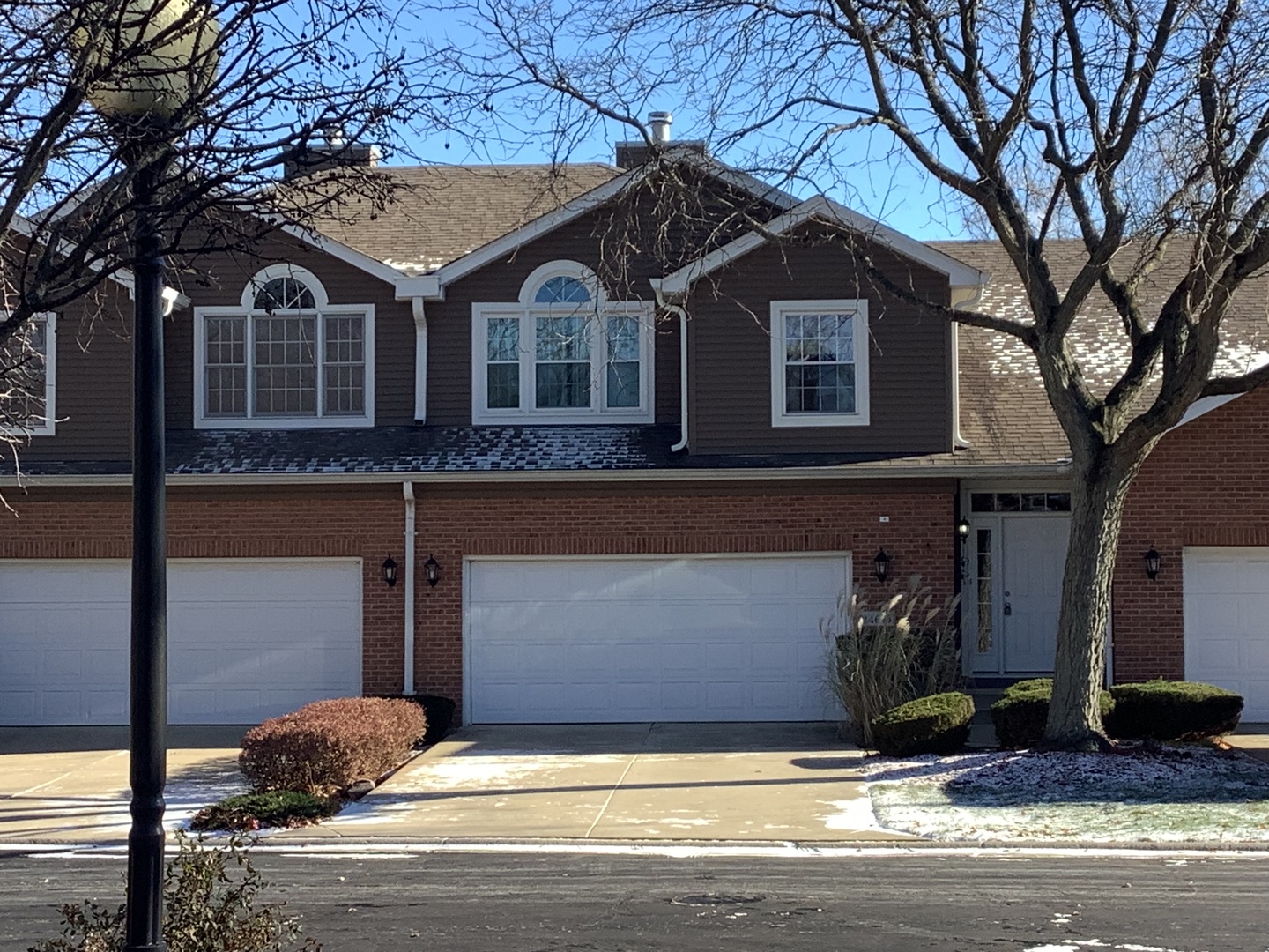 a front view of a house with garage