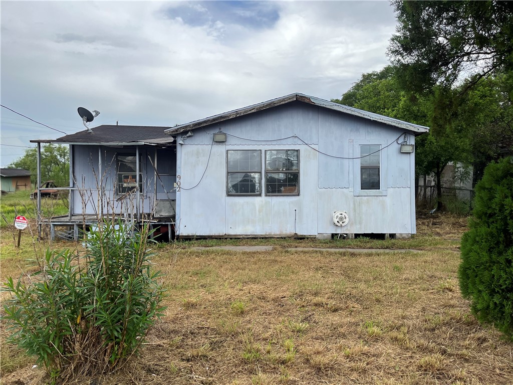 a house with trees in the background