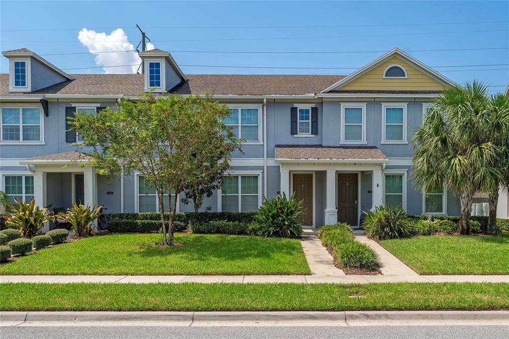 a front view of a house with a yard