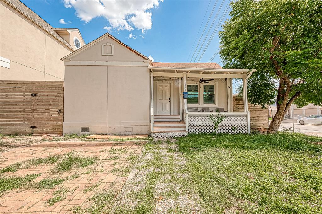 a view of a house with a fence