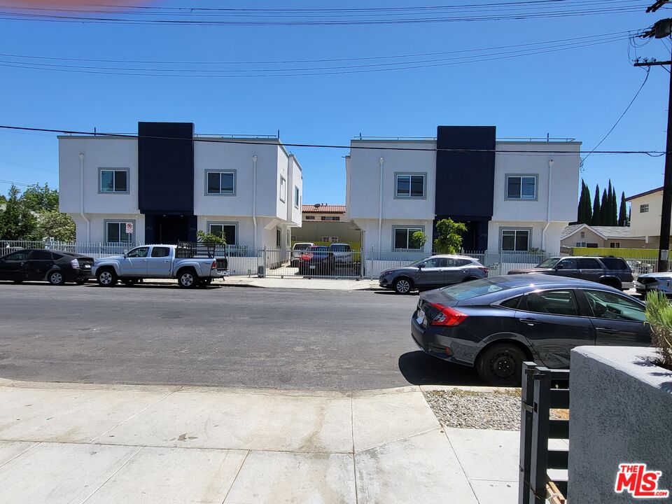 a cars parked in front of a building