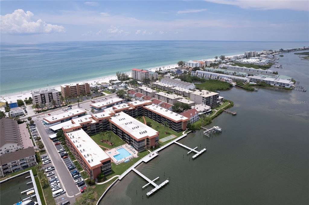 an aerial view of a city with ocean view