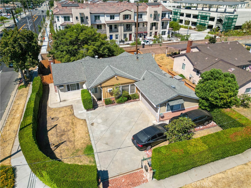 an aerial view of a house with a garden and plants