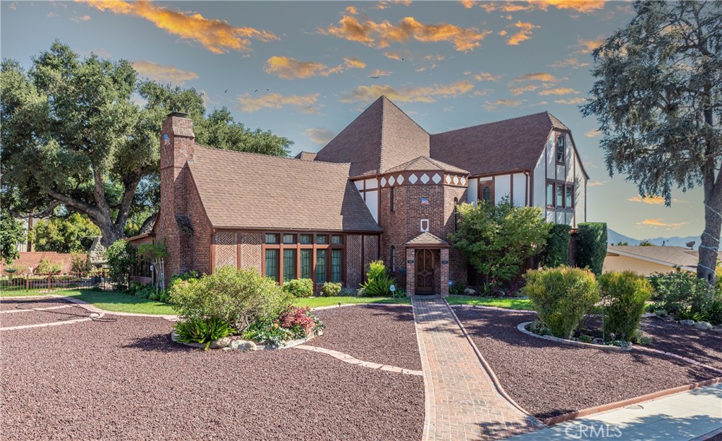 a front view of a house with a yard and a garage