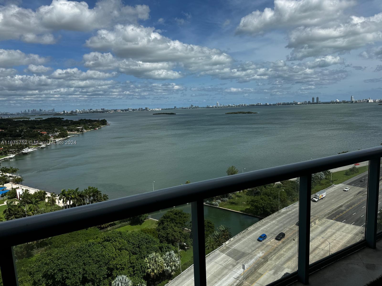 a view of a lake from a balcony