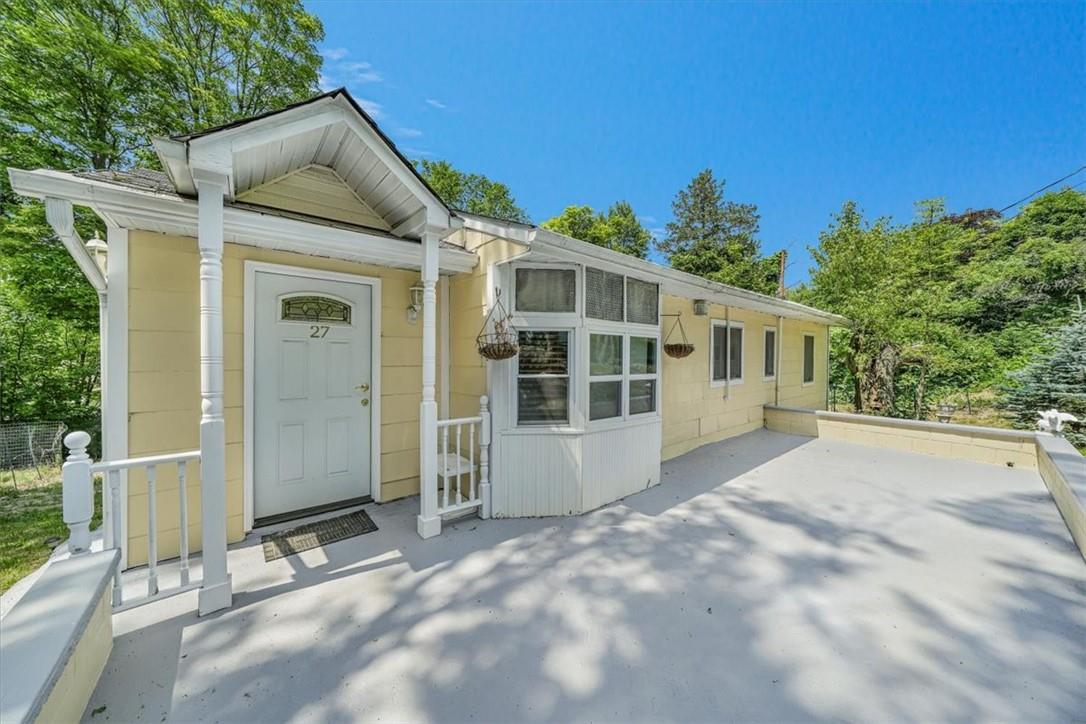 View of front of property featuring a patio area