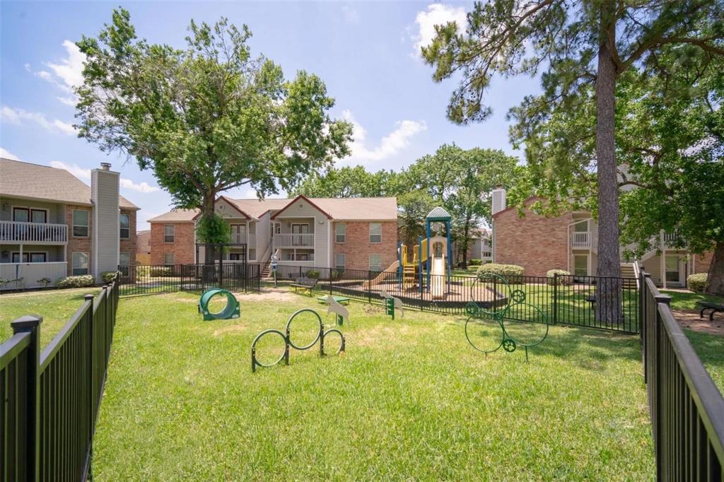 a swimming pool with outdoor seating and yard