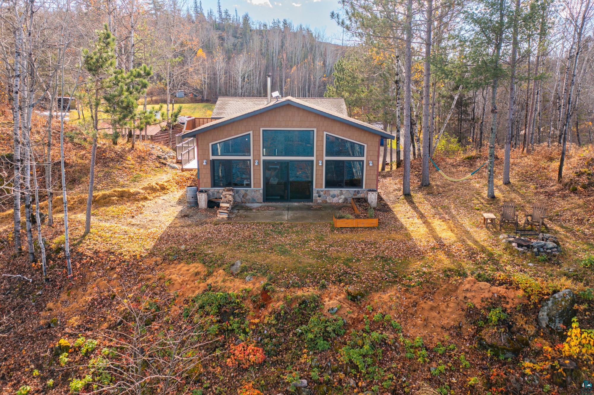 Back of property featuring a patio and a sunroom