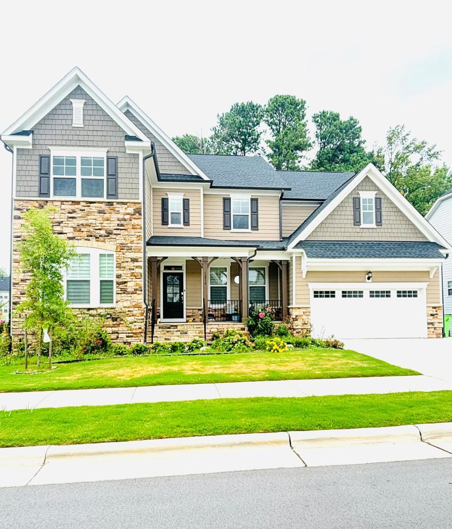 a front view of a house with a yard