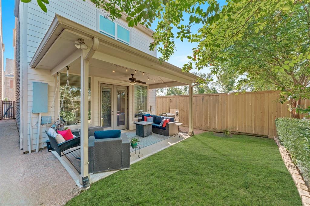 a view of a backyard with a small cabin and a chair