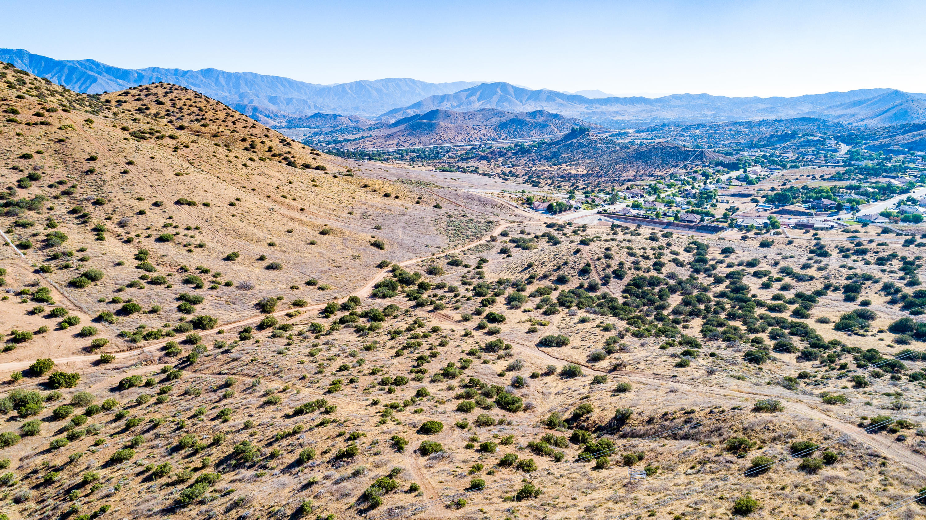 a view of a large mountain with mountains in the background