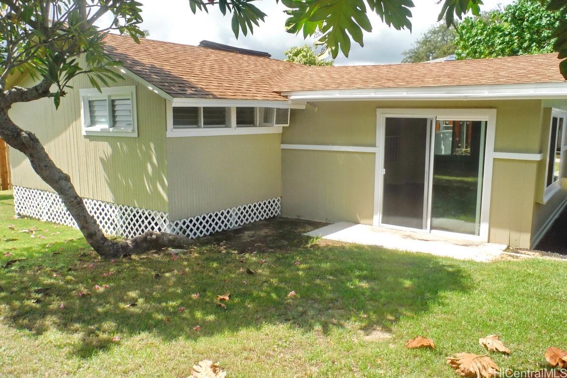 a view of a backyard of a house