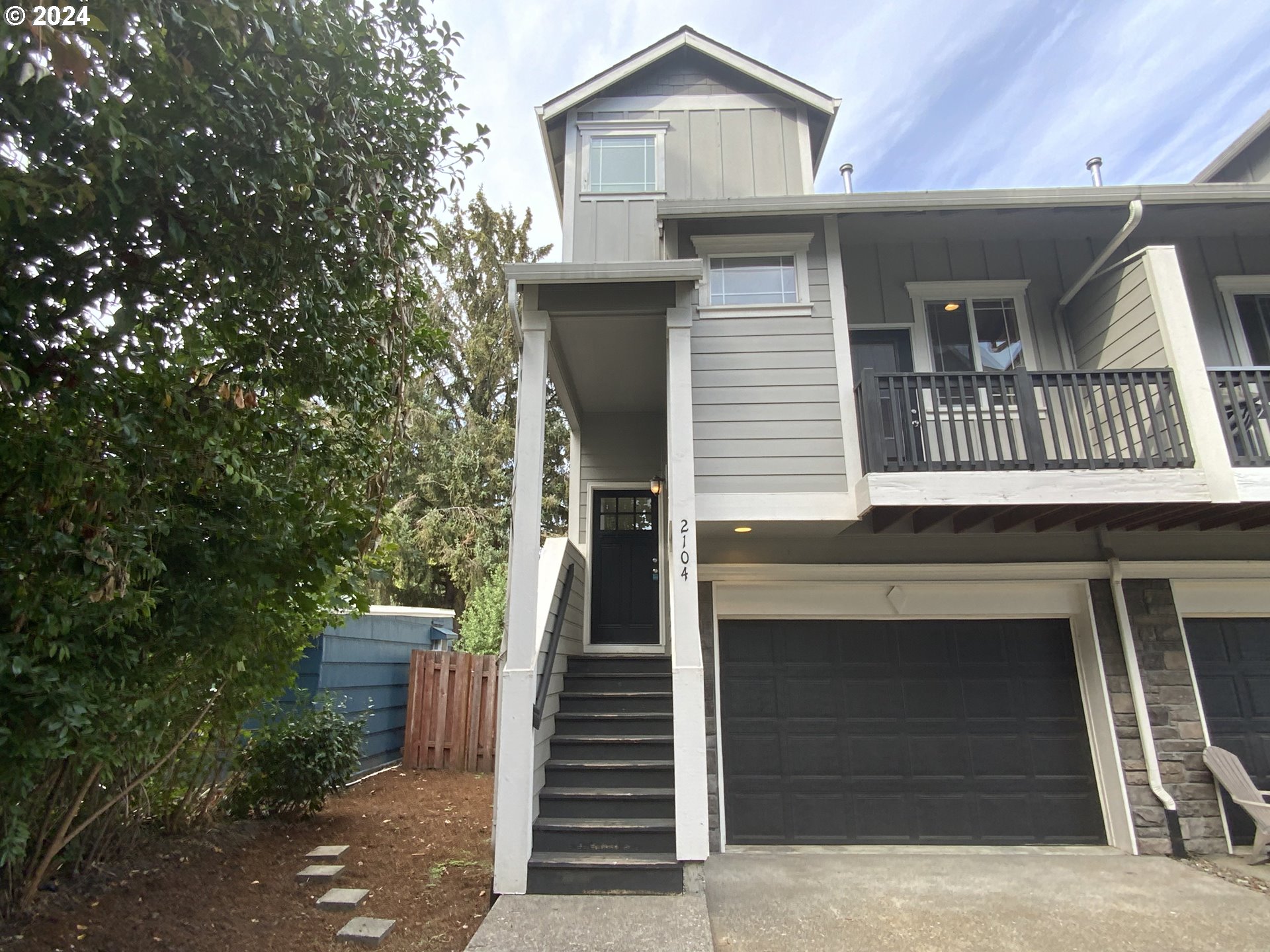 a front view of a house with a garage