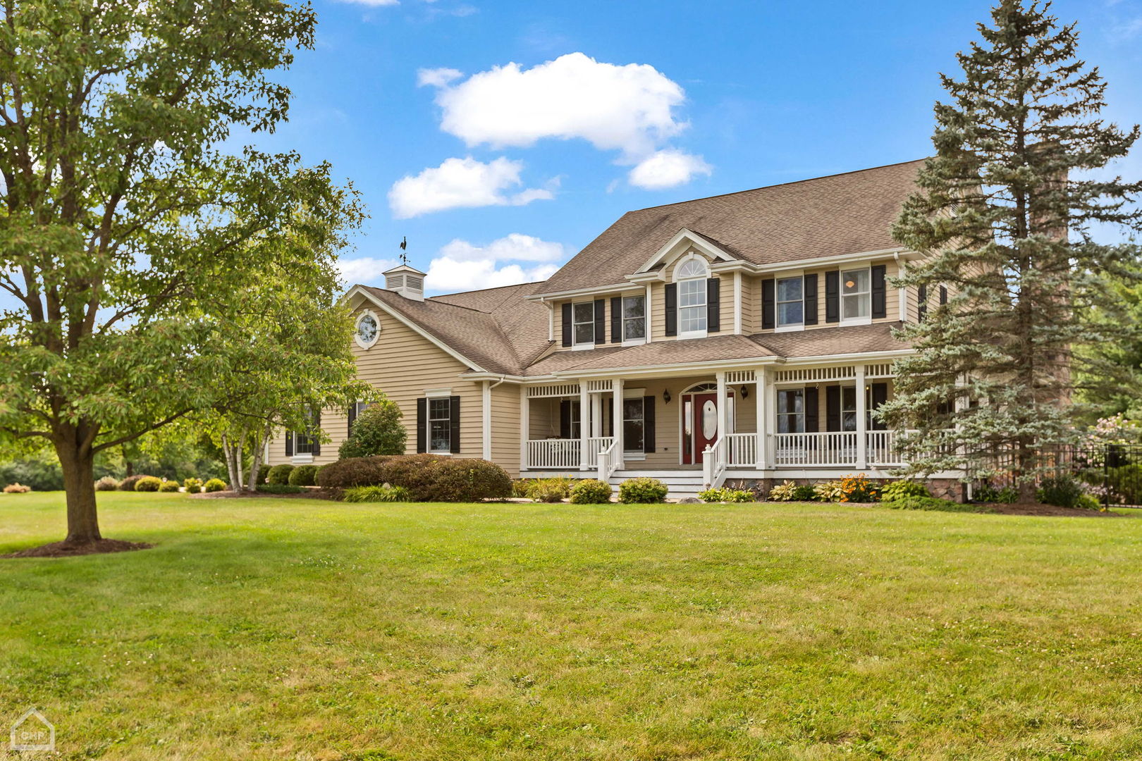 a front view of house with yard and trees