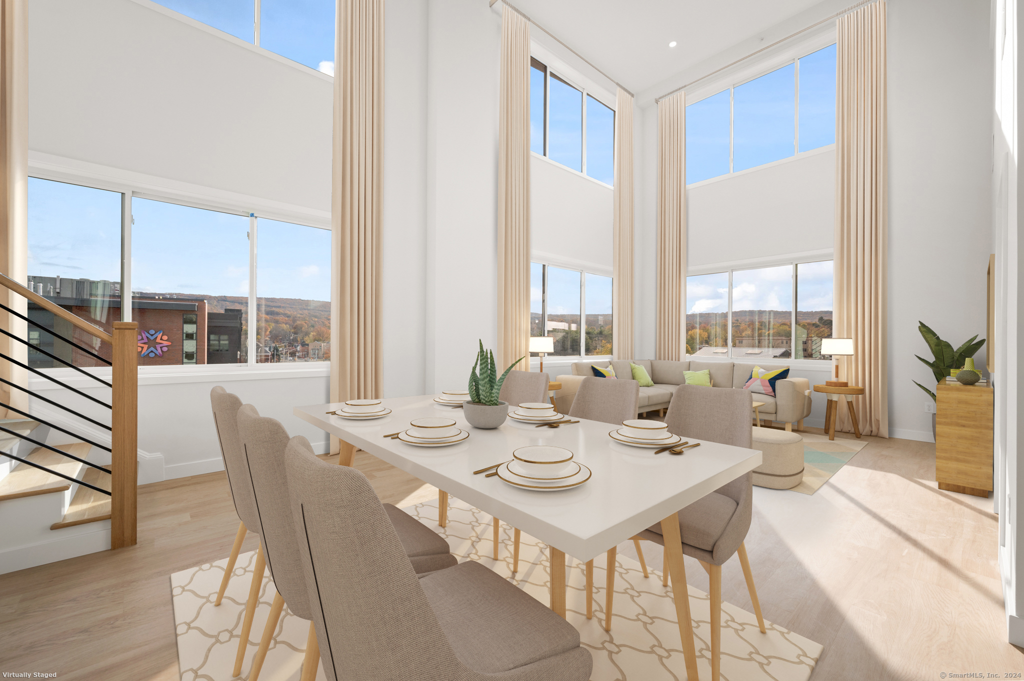 a view of a dining room with furniture window and wooden floor