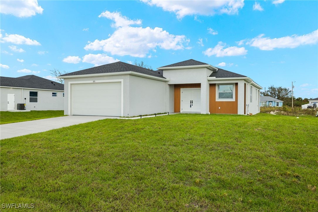 a front view of house with yard and green space