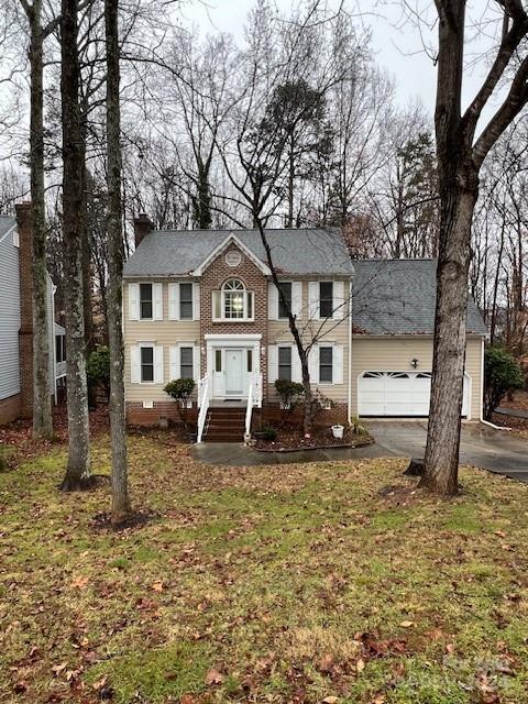 a house that has a tree in front of it