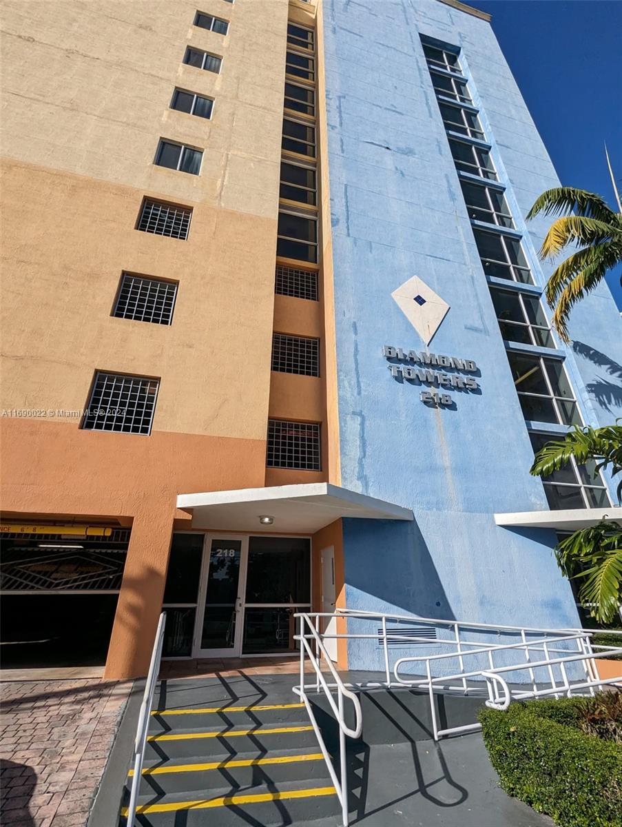 a front view of a building with outdoor space