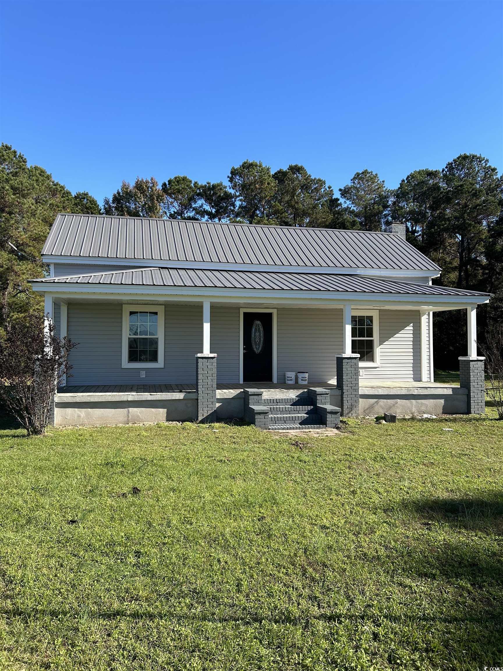 View of front of property featuring covered porch