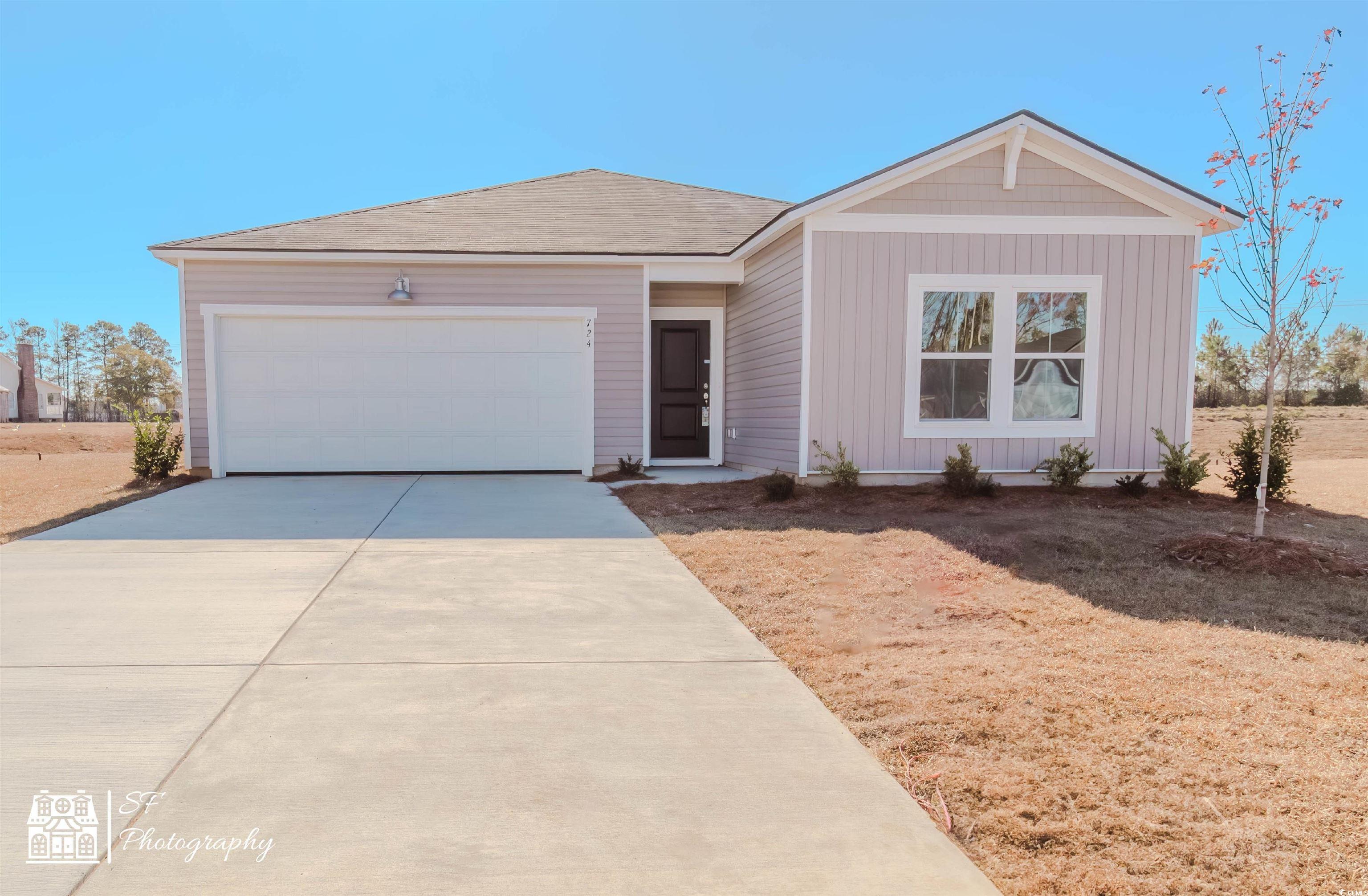 Single story home featuring a garage