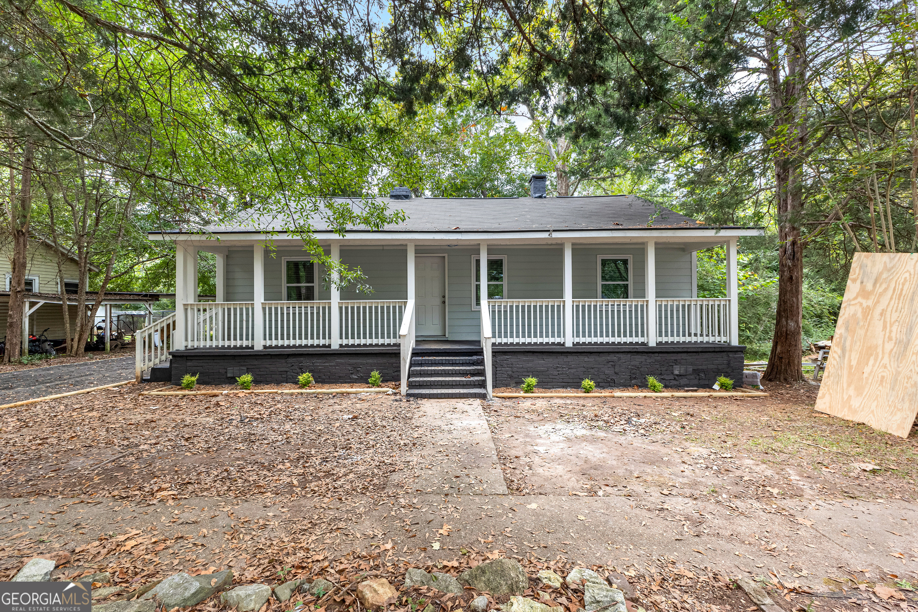 a house with trees in the background