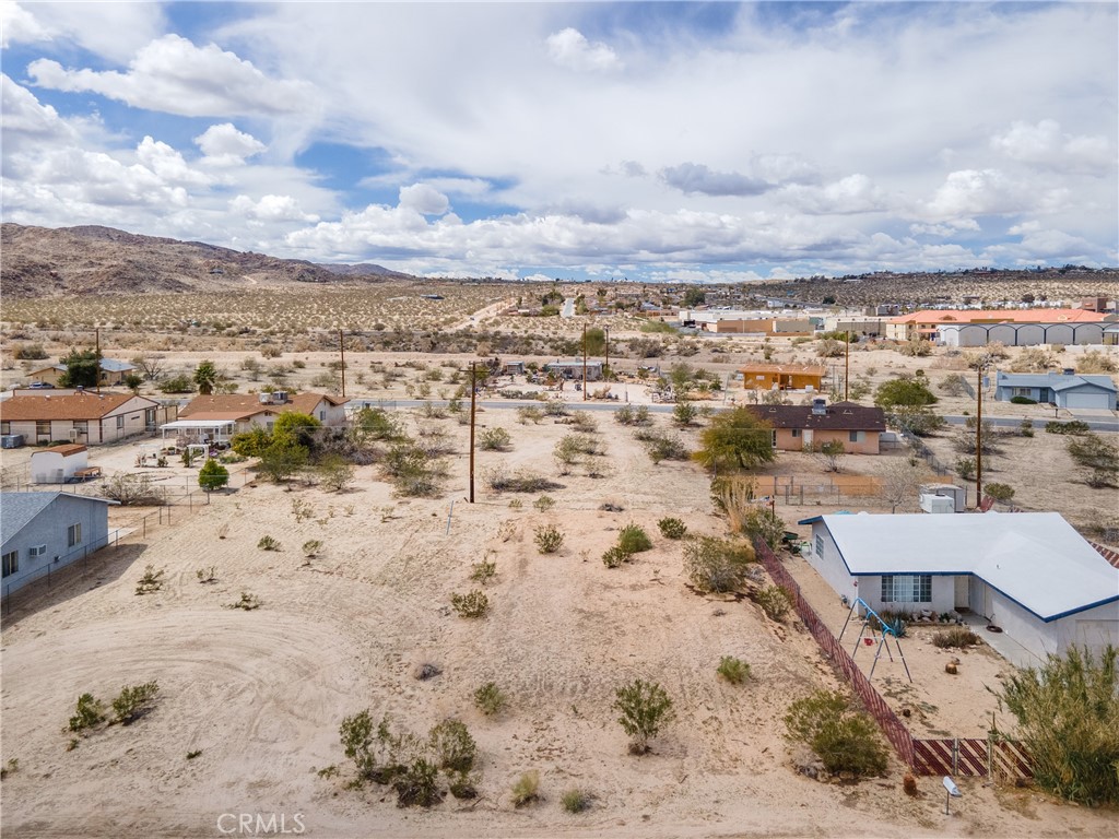 an aerial view of residential houses with wooden fence