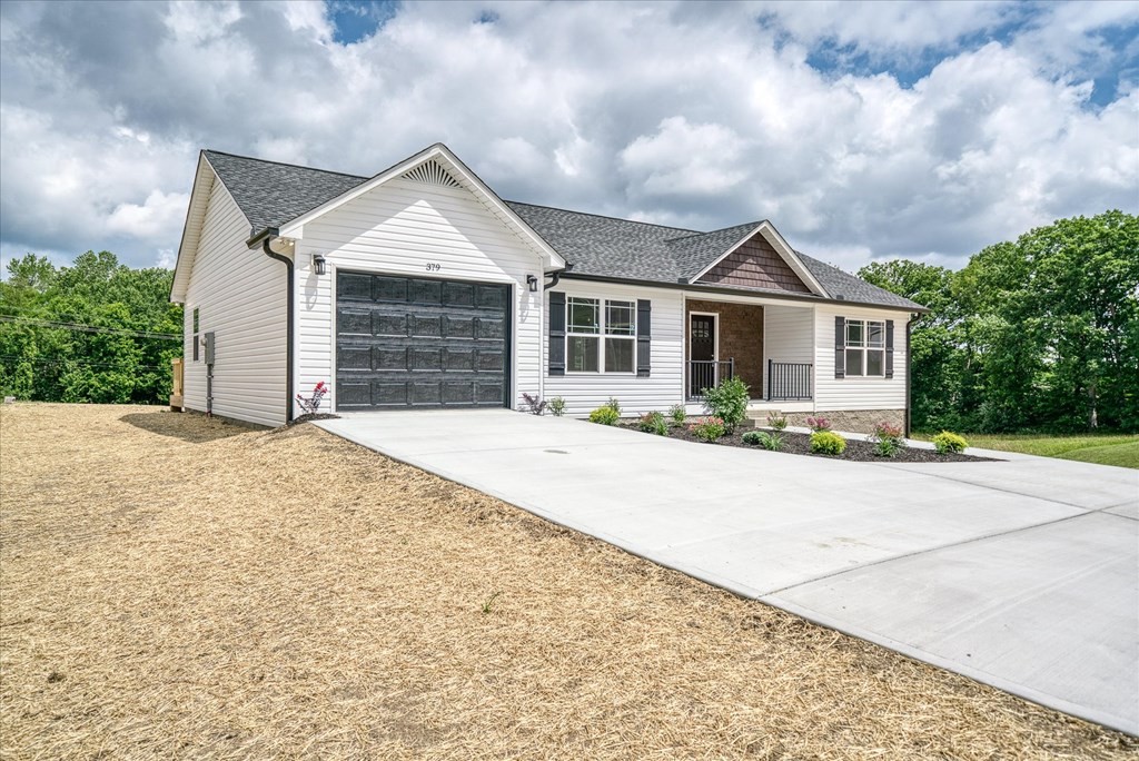 front view of a house with a yard