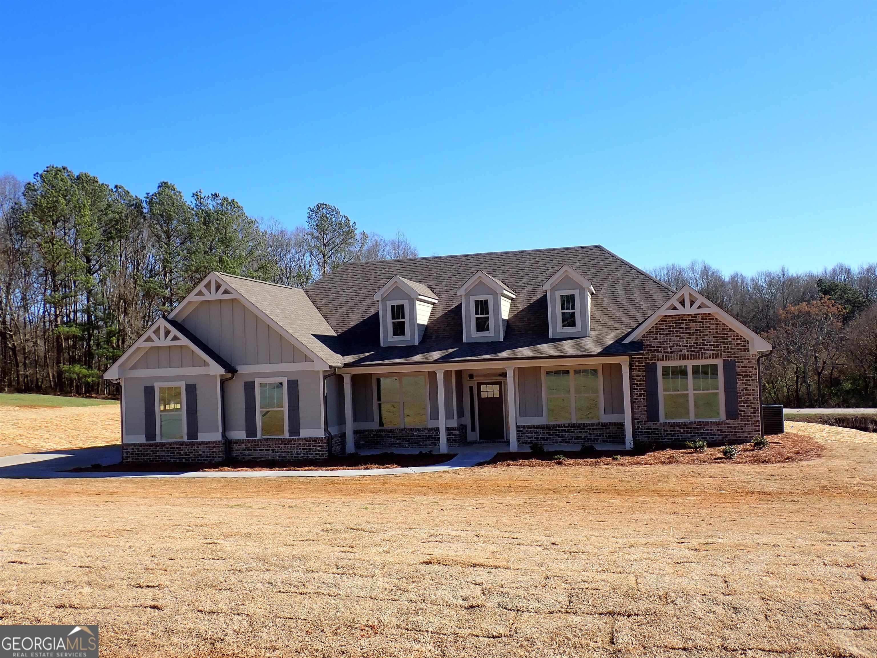 a front view of a house with a yard