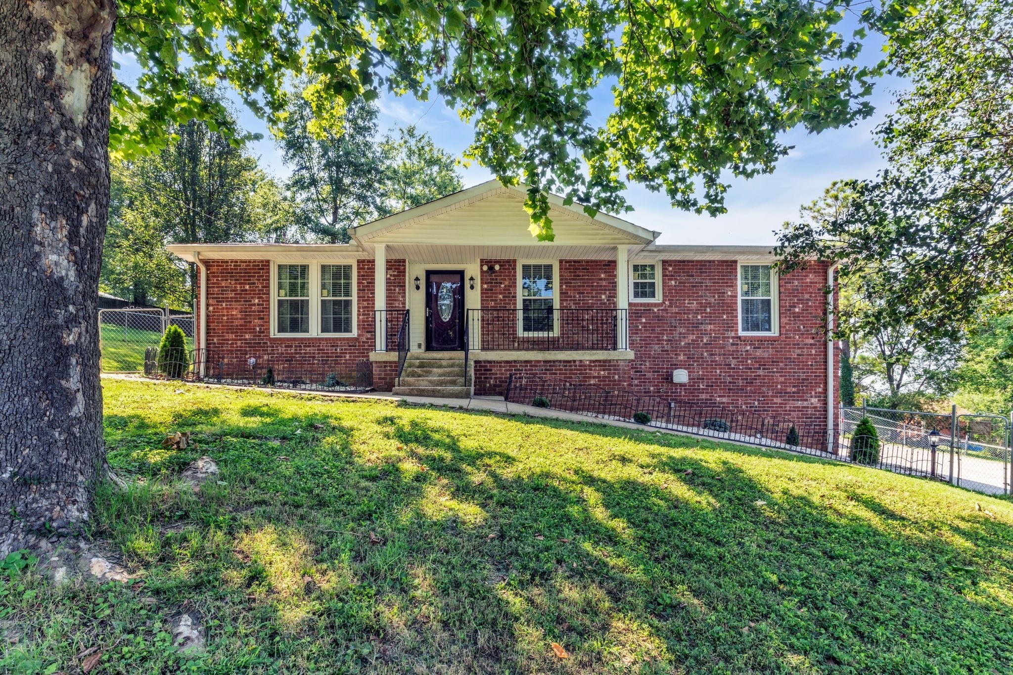 a front view of a house with a yard