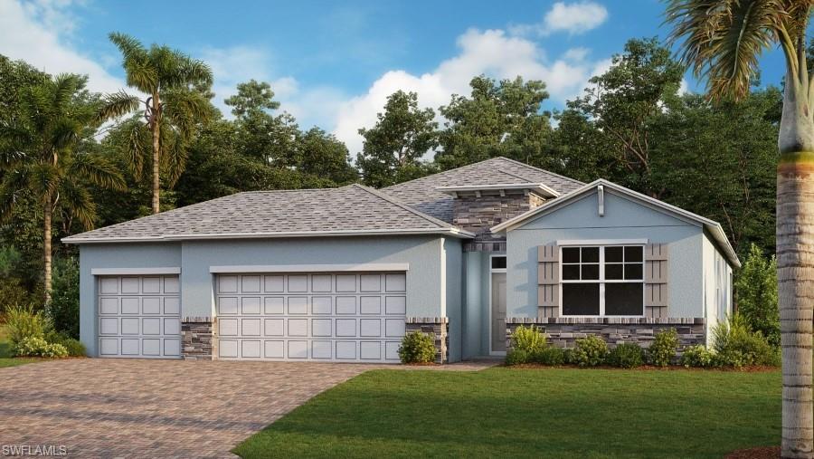 Ranch-style house featuring a garage and a front yard