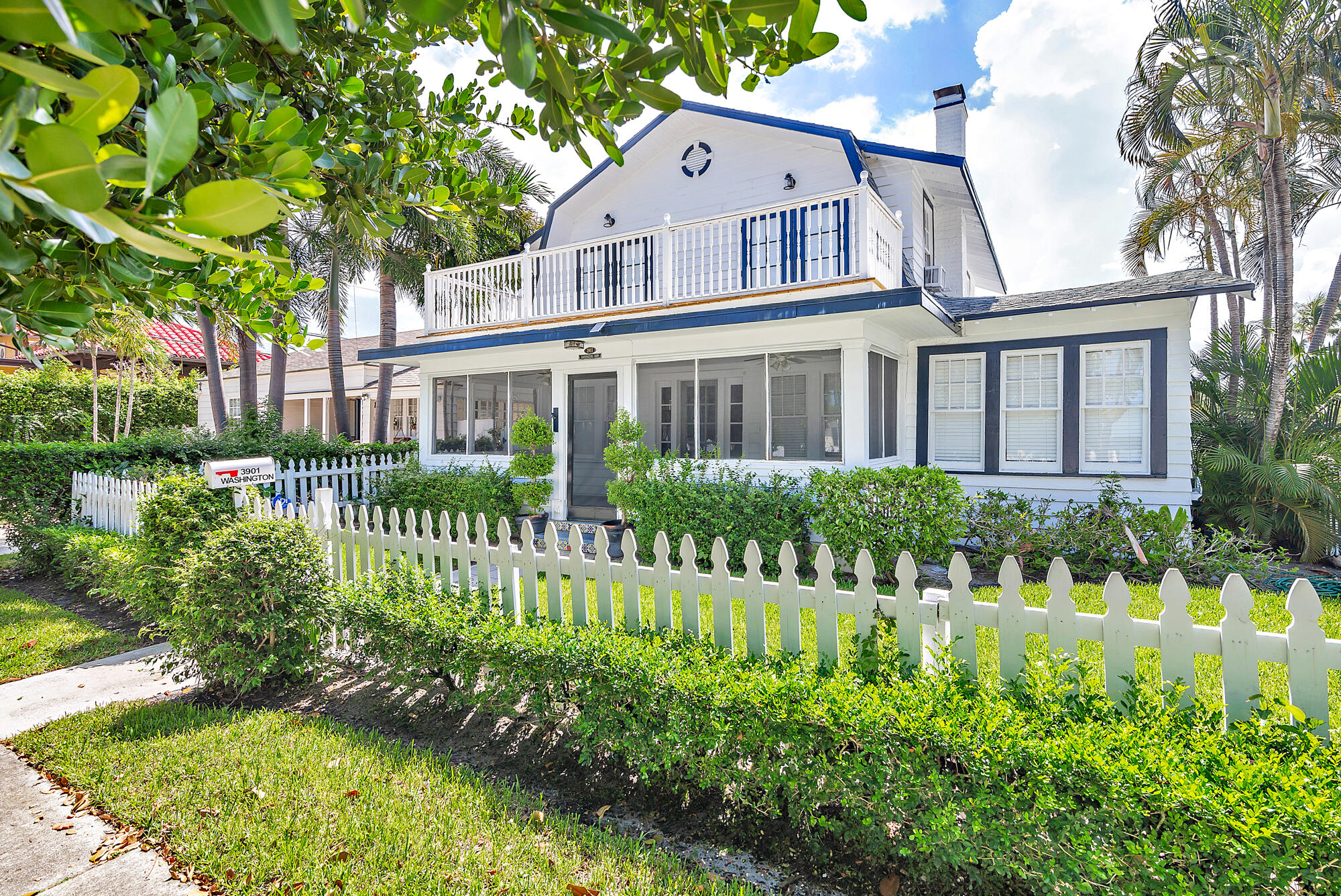 a view of a house with a small yard and plants