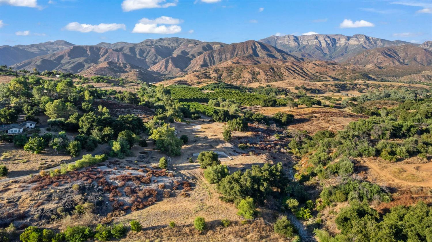 a view of a city with mountains in the background