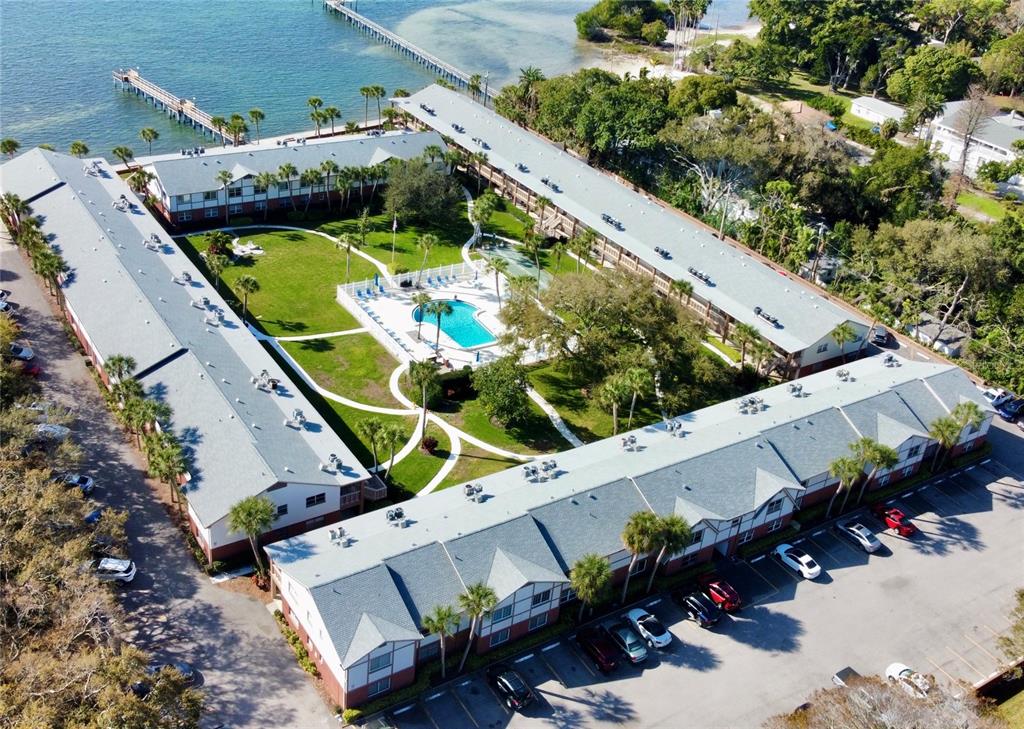 an aerial view of a house with a garden and swimming pool