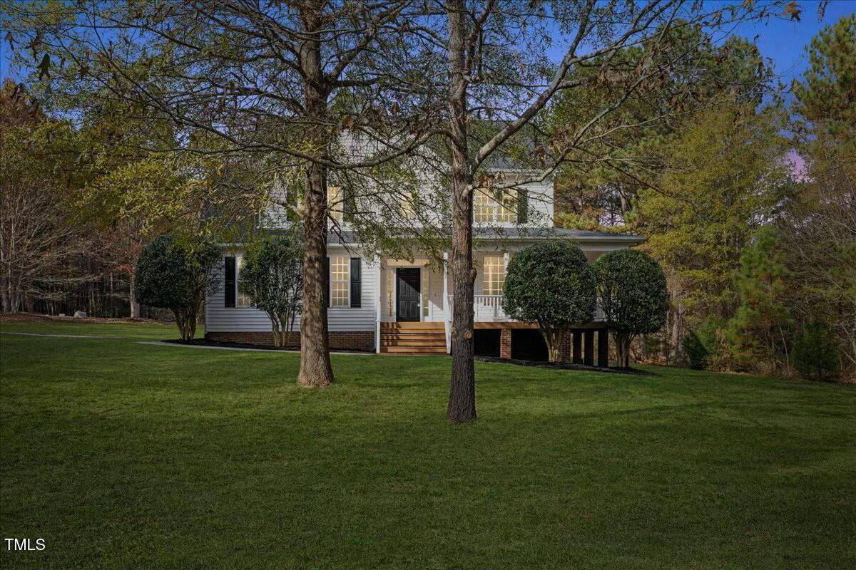 a view of a house with a big yard