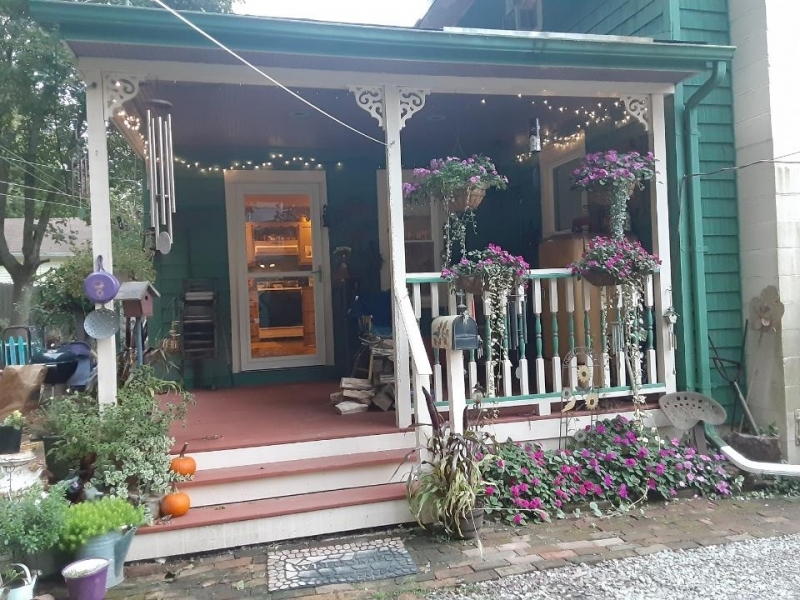 a front view of a house with a porch