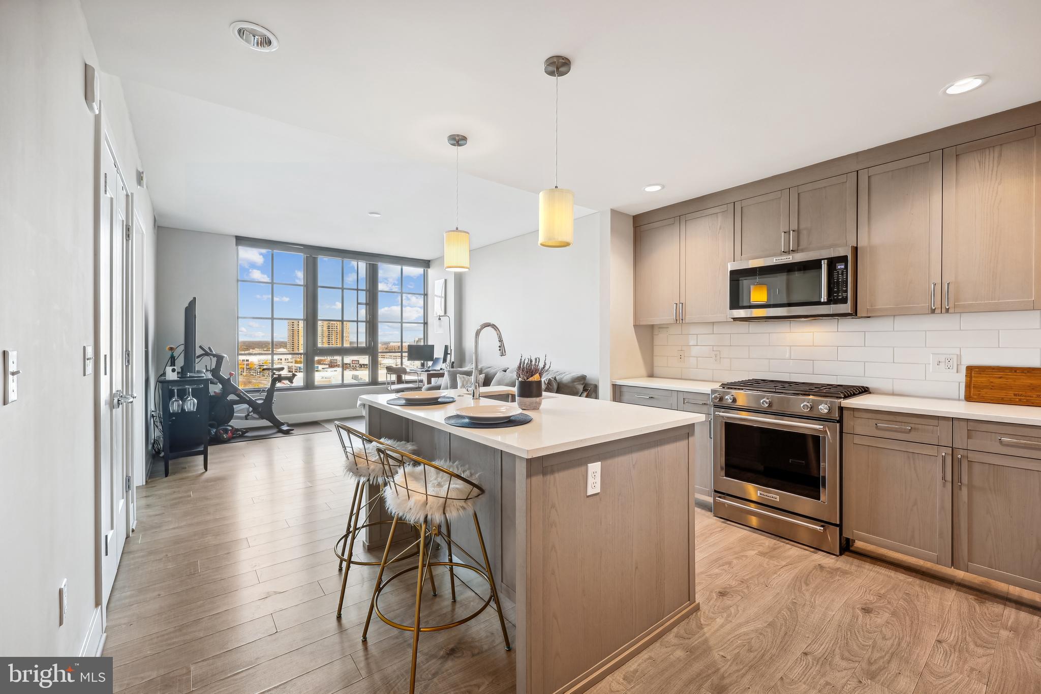 a kitchen with a stove a sink and a refrigerator