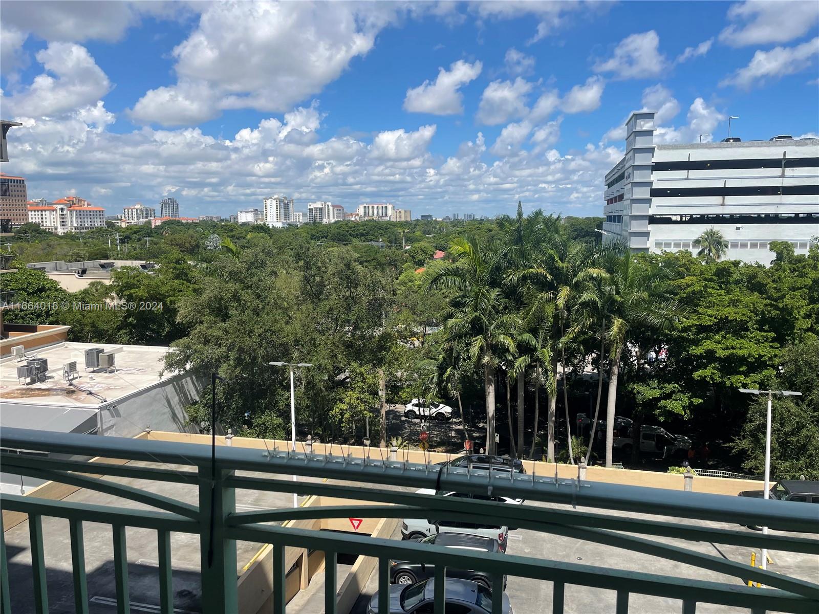 a view of a chairs and table in a balcony