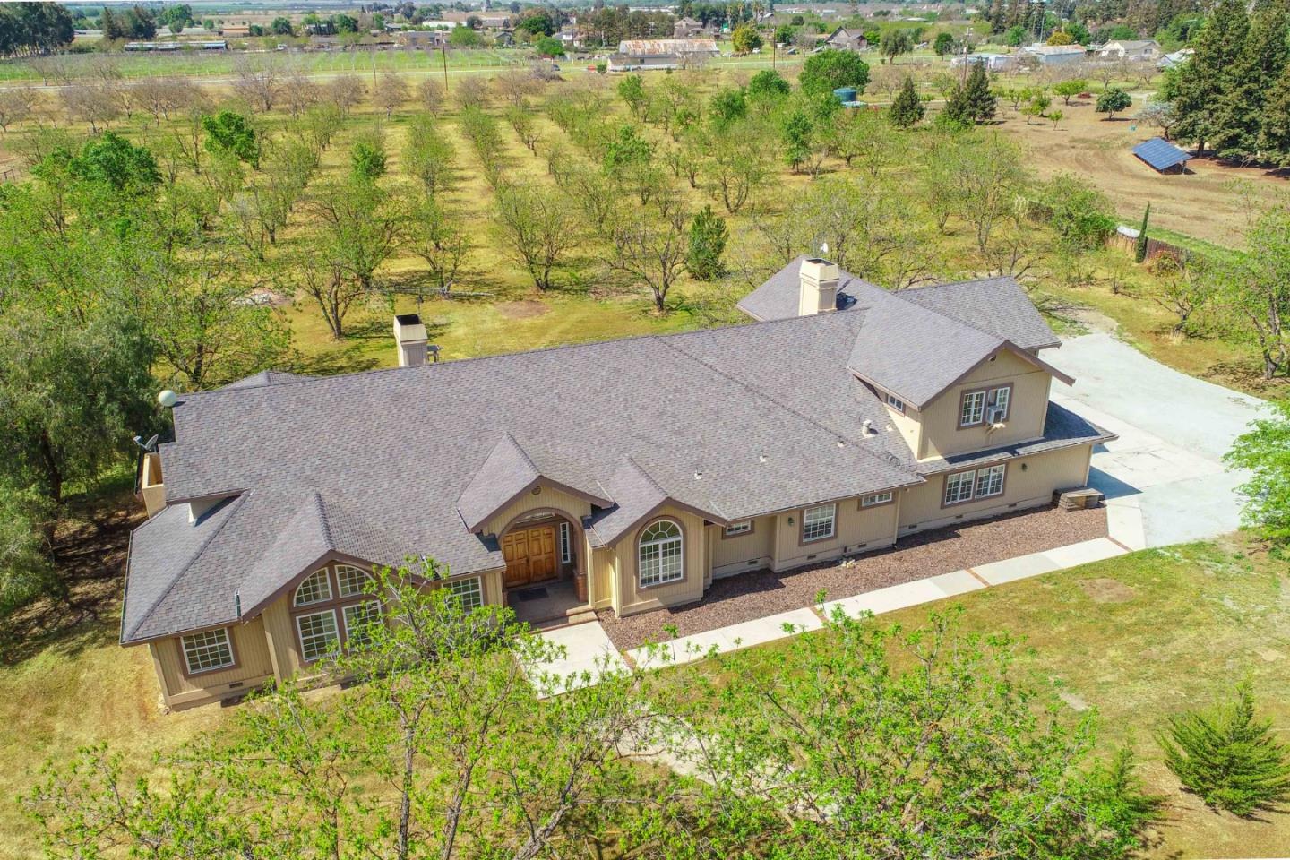 an aerial view of a house with a ocean view