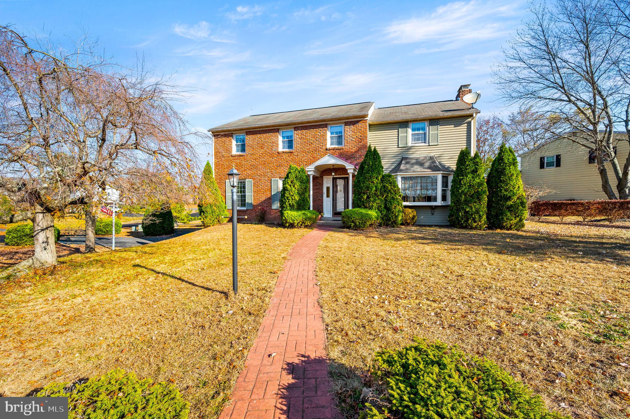 a view of house with yard