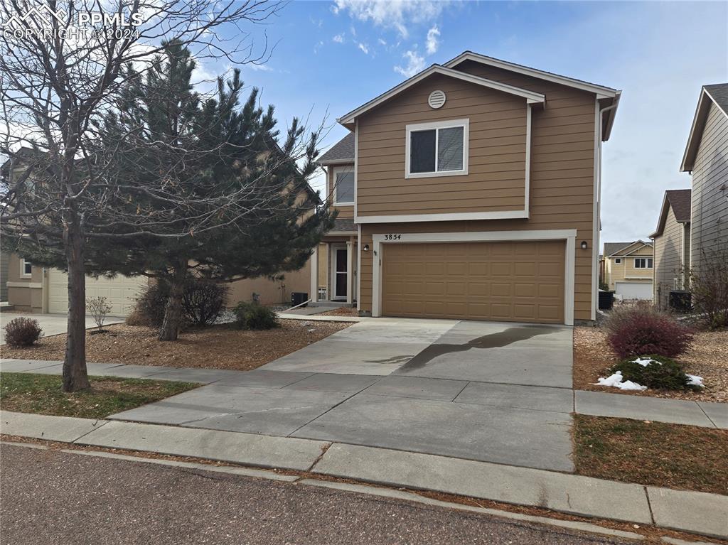 View of property featuring a garage