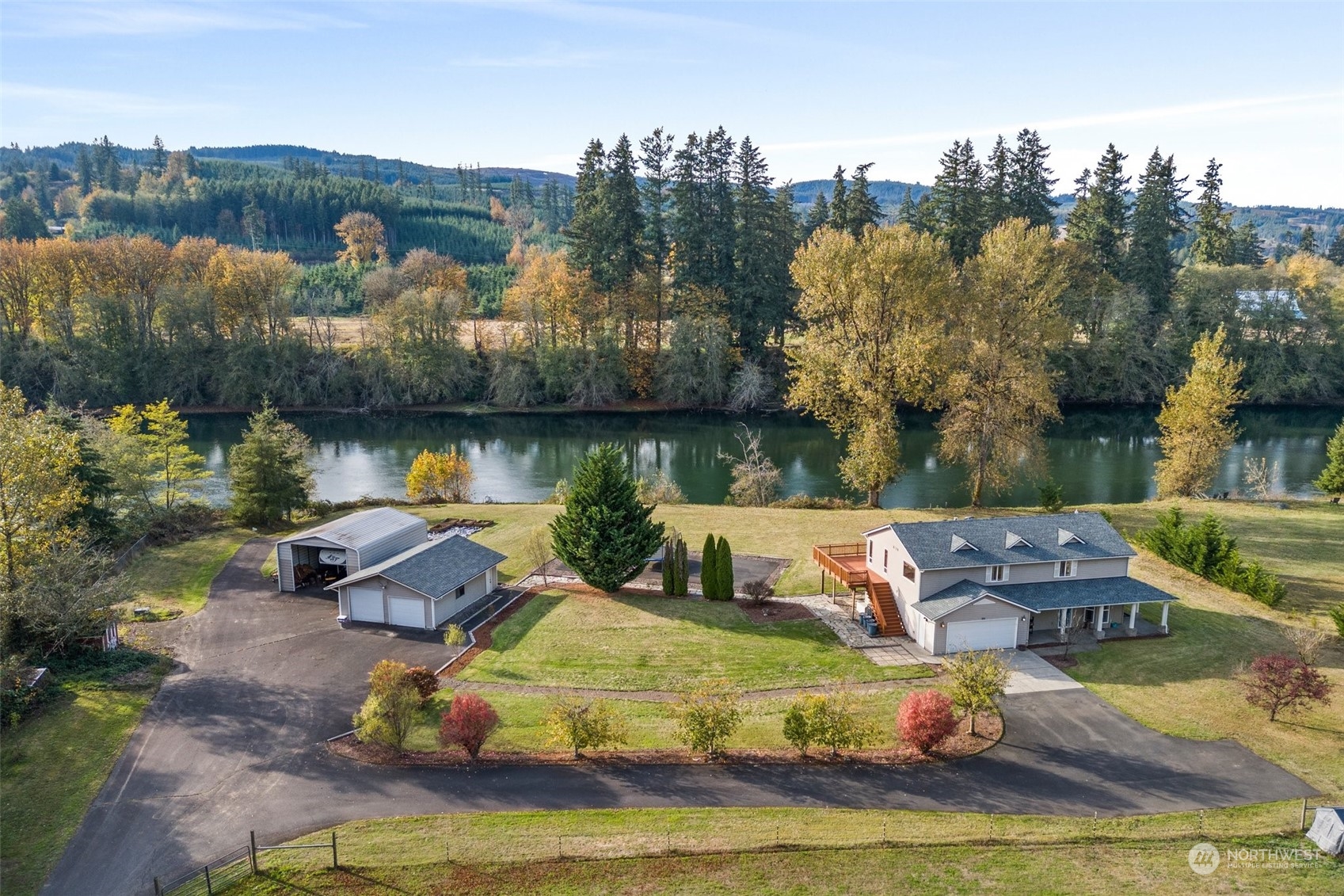 an aerial view of a house with lake view