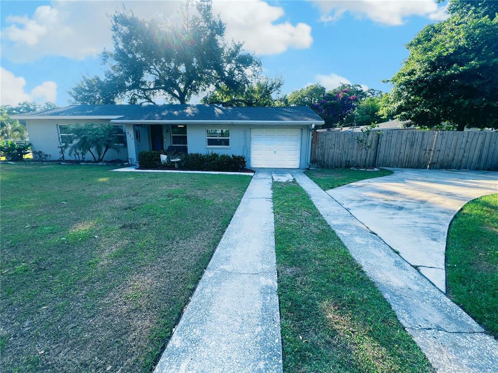 front view of a house with a yard