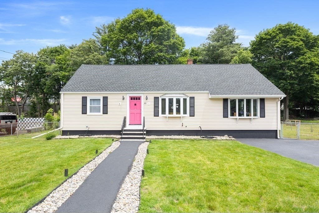 a front view of a house with a yard