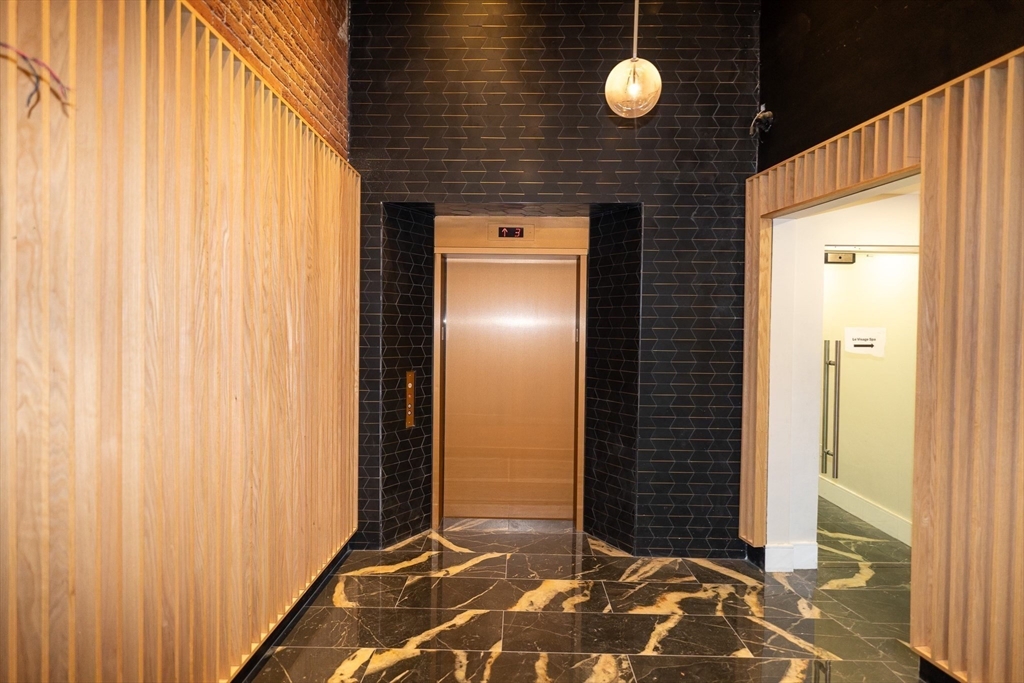 a view of a door with wooden floor