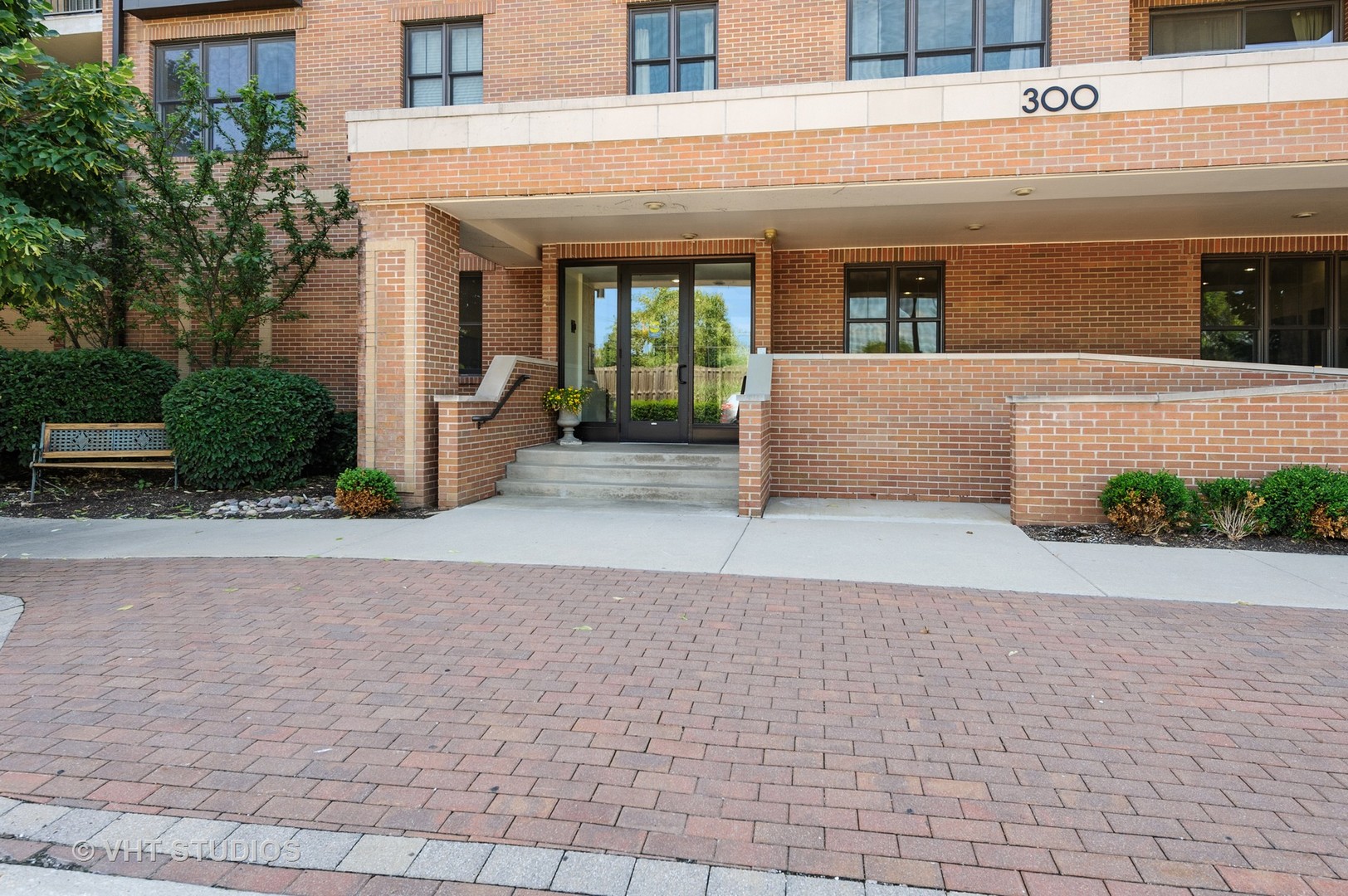 a view of a building with potted plants