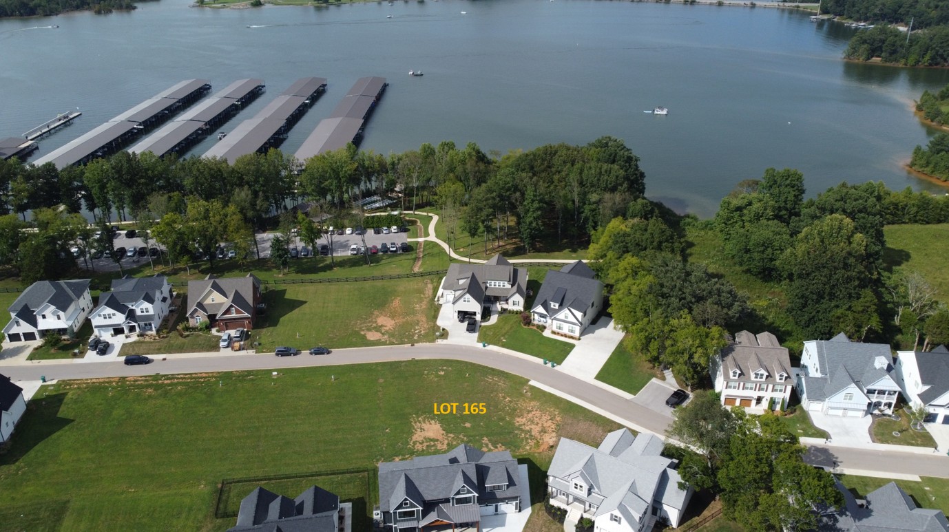 an aerial view of a house with a lake view