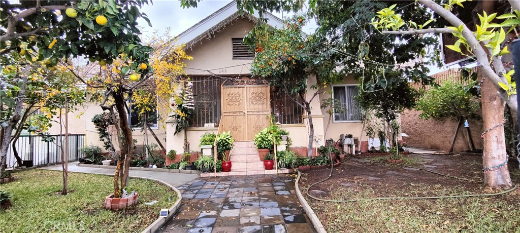 a front view of a house with garden