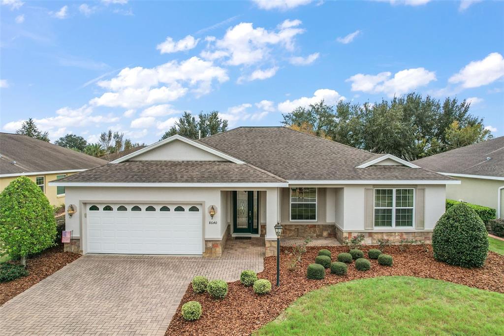 front view of a house with a yard