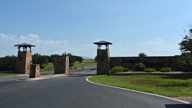 a park view with a sign board