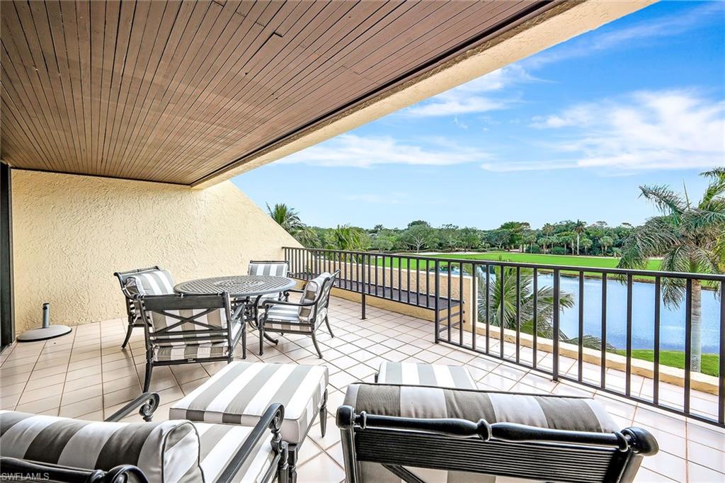 a view of a patio with wooden floor